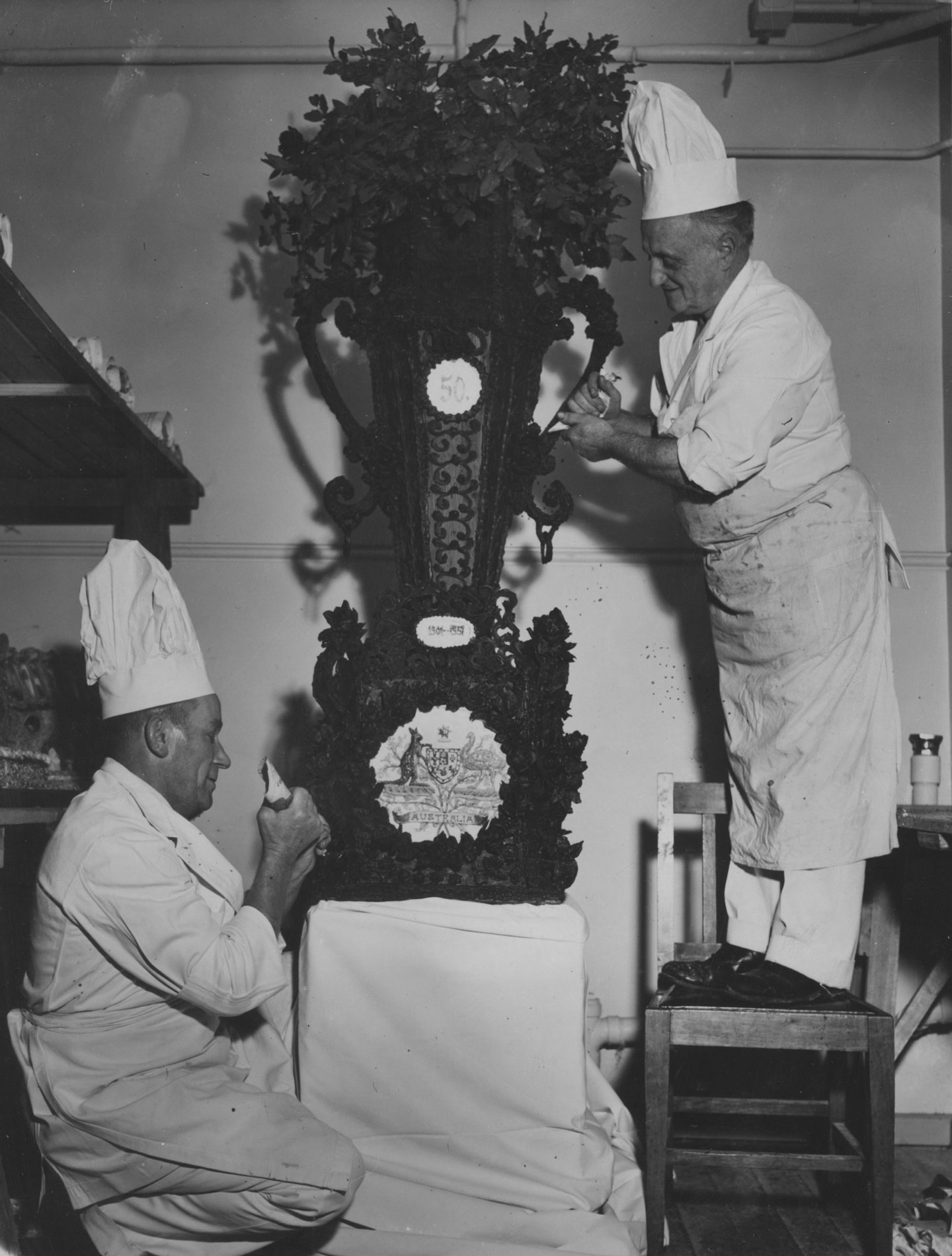 Chefs decorating a centrepiece for the Federation Jubilee Banquet in Old Parliament House