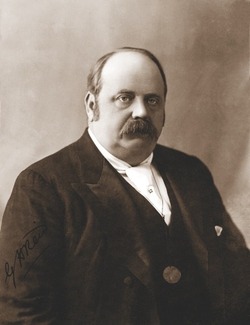 A scan of a black and white portrait image showing former politician George Reid.