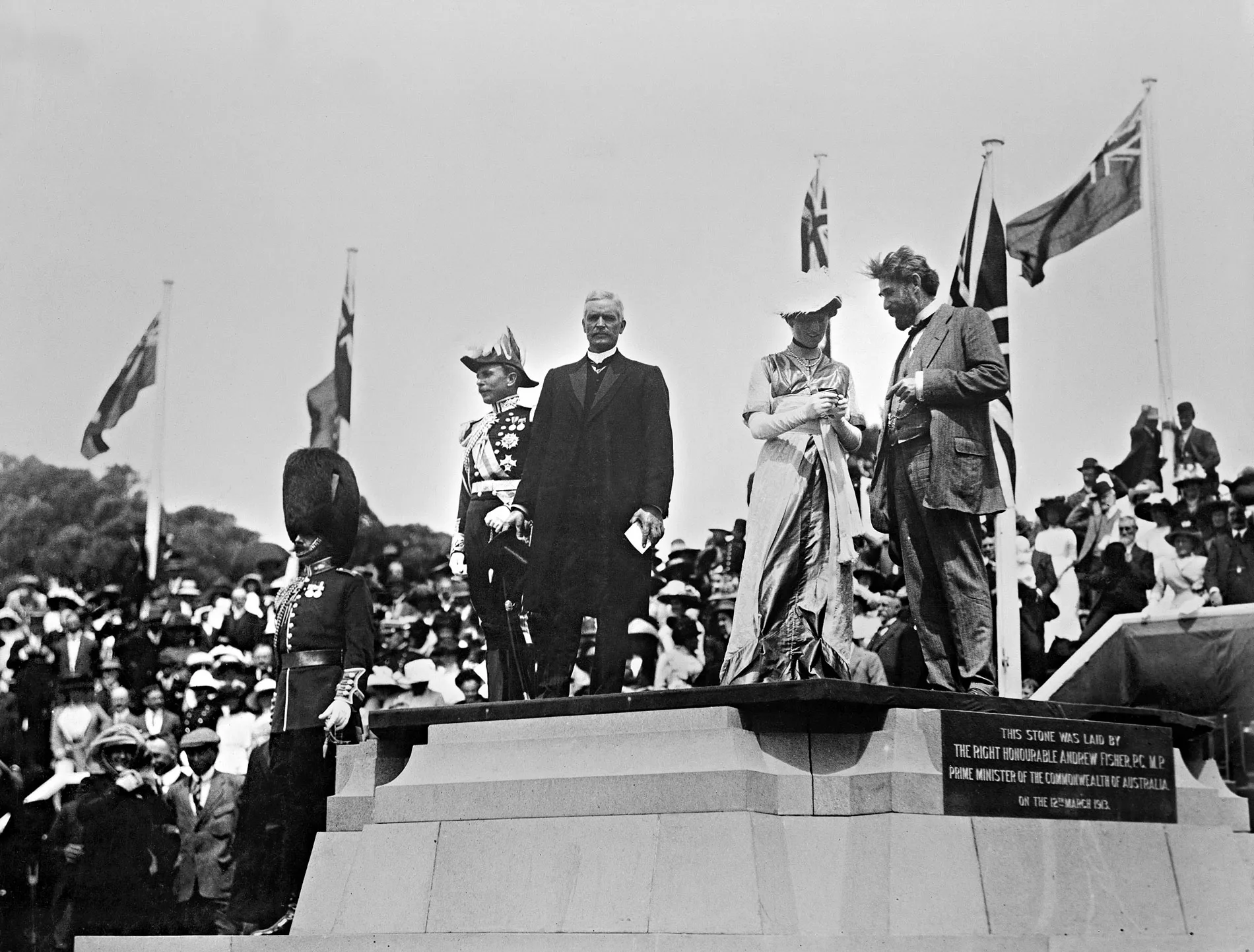 Governor-General Lord Denman, Lady Denman, Prime Minister Andrew Fisher and King O'Malley stand on a commemorative stone in Canberra.
