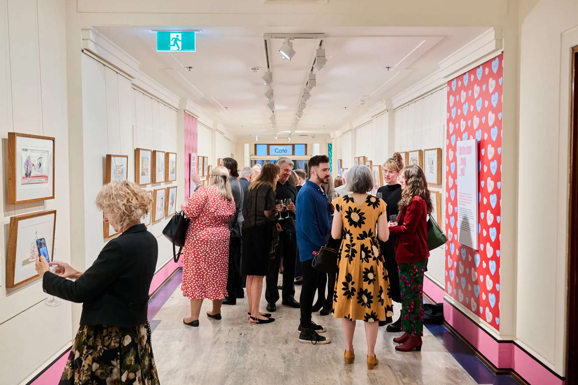 An image of partners of the Museum of Australian Democracy gathered around the Behind the Lines Exhibition 2024 Opening