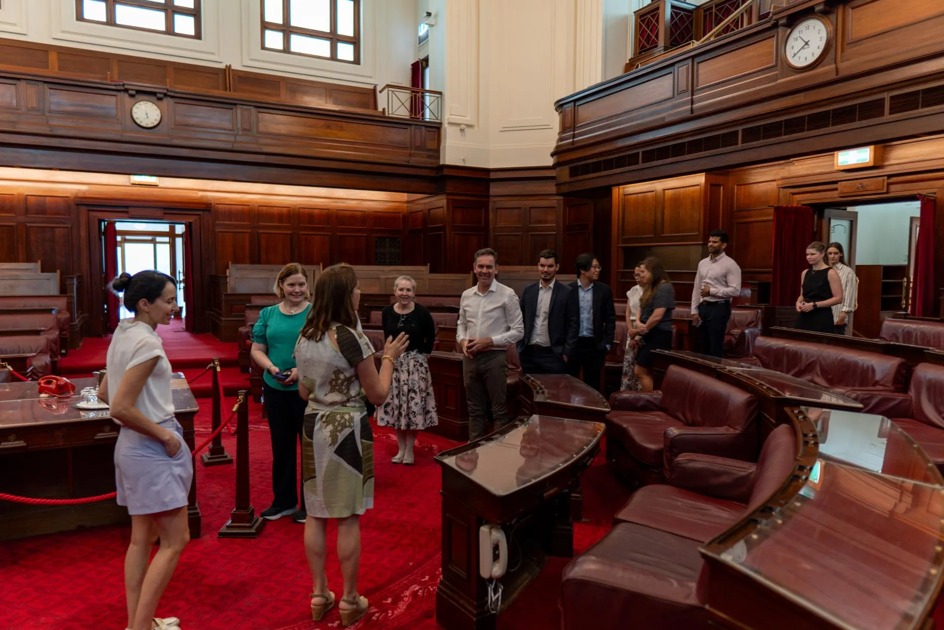 People on a tour in the Senate Chambers at Old Parliament House.