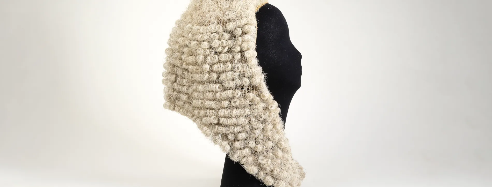 An image of the wig worn by the Speaker of the House of Representatives on a mannequin head
