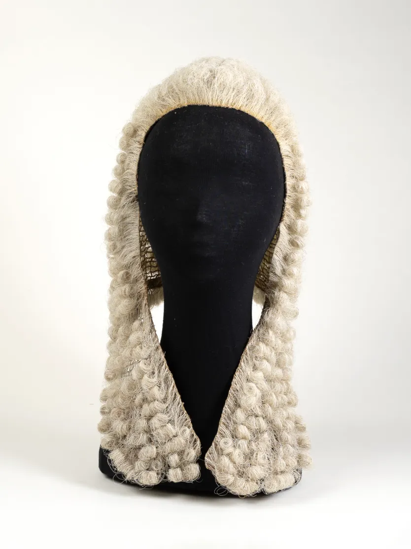 An image of the wig worn by the Speaker of the House of Representatives on a mannequin head