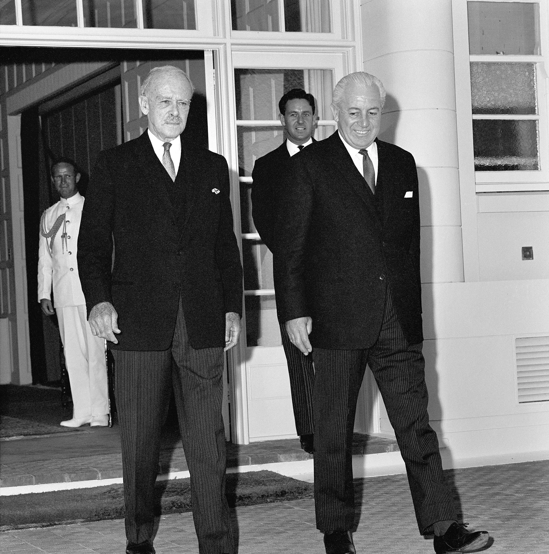 Governor-General Lord Casey and Prime Minister Harold Holt walk out of Government House in Canberra.