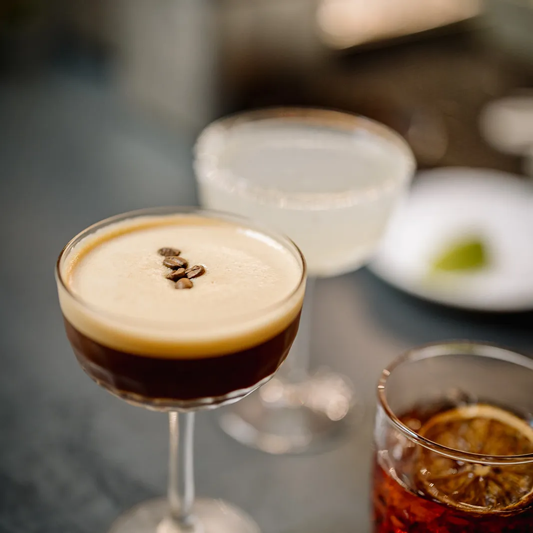 An espresso martini, margherita and an old fashioned sitting on the bar at Old Parliament House.