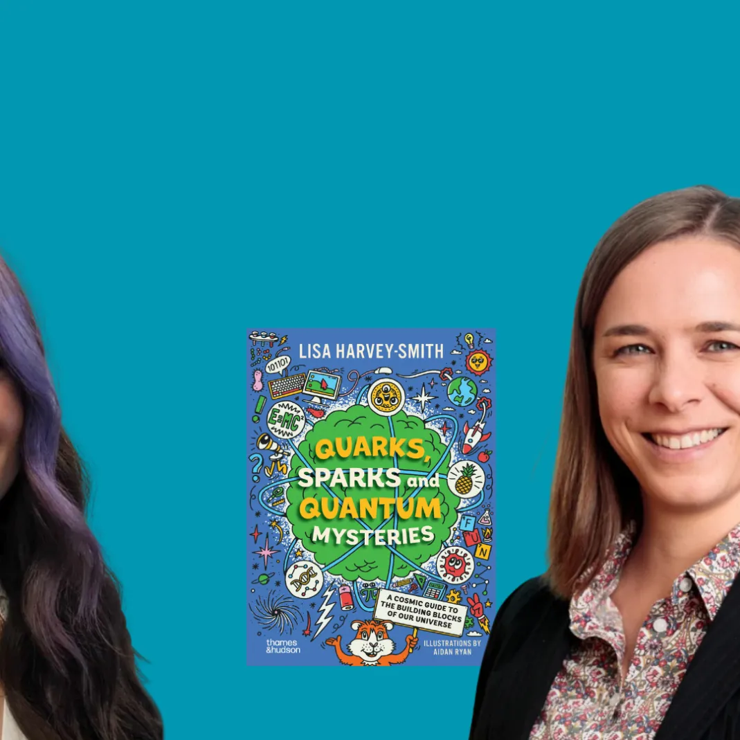 A photograph of Lisa Harley-Smith and Tessa Grayston next to Lisa's book 'Quarks, Sparks and Quantum Mysteries'.