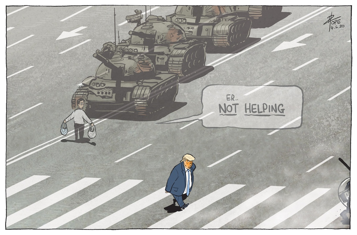 Donald Trump walks across a zebra crossing. Further up the street a man holding two bags stands in front of a line of tanks. The man looks at Trump and says, 'Er... not helping'.