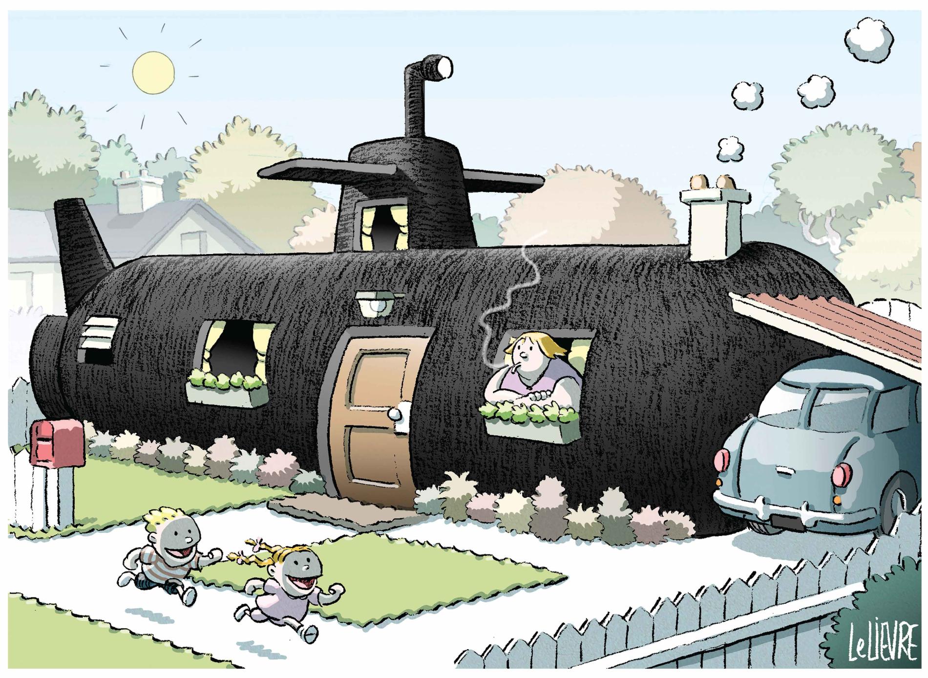 A woman watches her kids play from a small cottage made from a black submarine. 