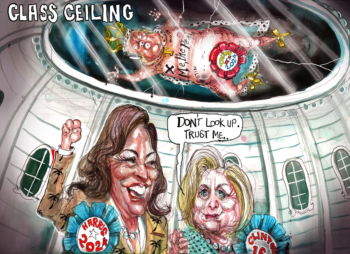 Kamala Harris holds her fist high. Hilary Clinton says to her, 'Don't look up. Trust me.' Above them is a cracked glass ceiling, with a semi-naked Donald Trump wearing a crown and royal robe lying face down on it. 