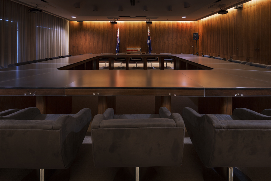 The Cabinet Room at Old Parliament House featuring a large table with chairs. The room is wood panelled.