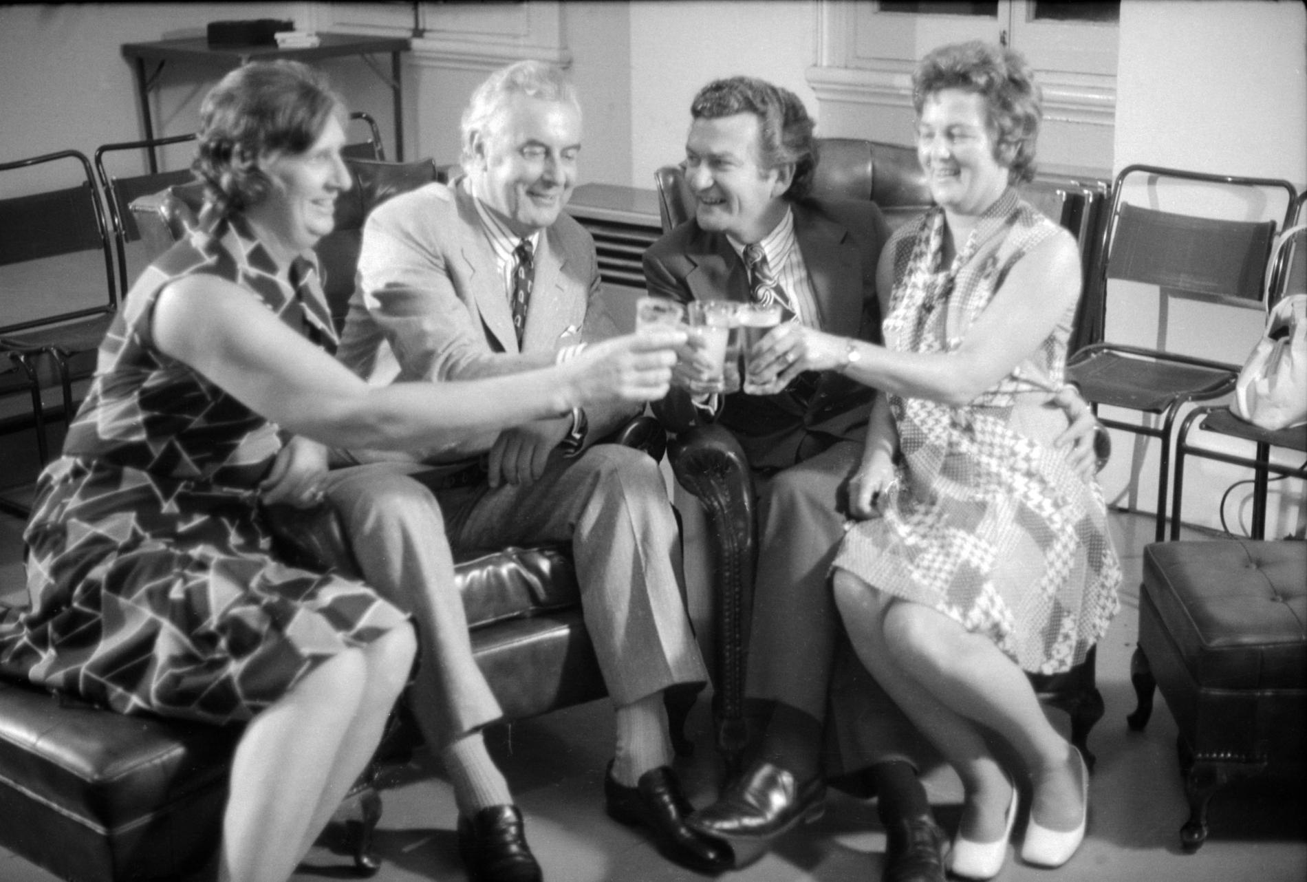 Gough and Margaret Whitlam clink their glasses with Bob and Hazel Hawke.