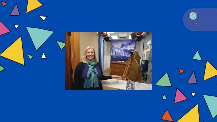 A woman stands in a recreated TV studio in Old Parliament House.
