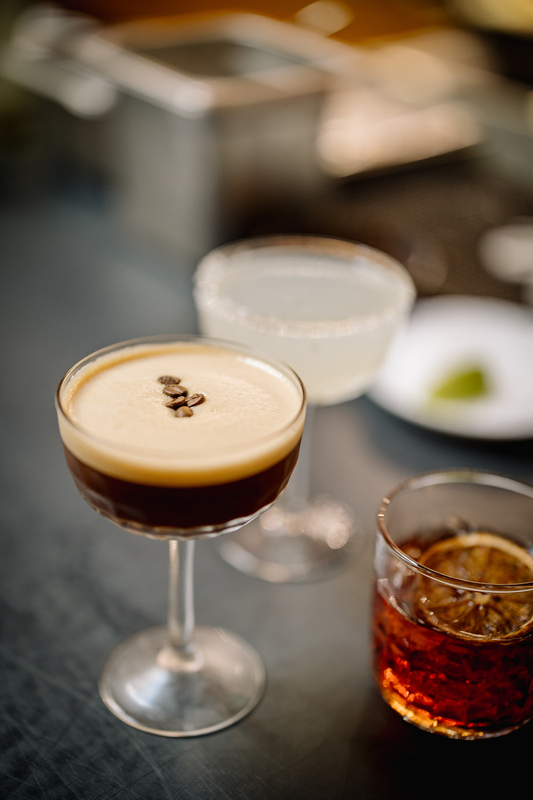 An array of cocktails on the Member's Bar. Included are an espresso martini, an old fashioned, and a margarita.
