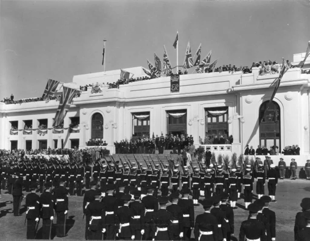 The Governor-General Sir William Slim addresses members of the defence forces from the front steps of Parliament House on coronation day.