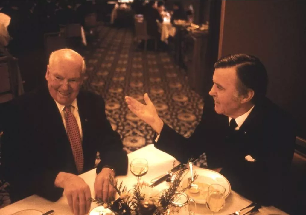 Fred Daly and Jim Killen sit at a dining table