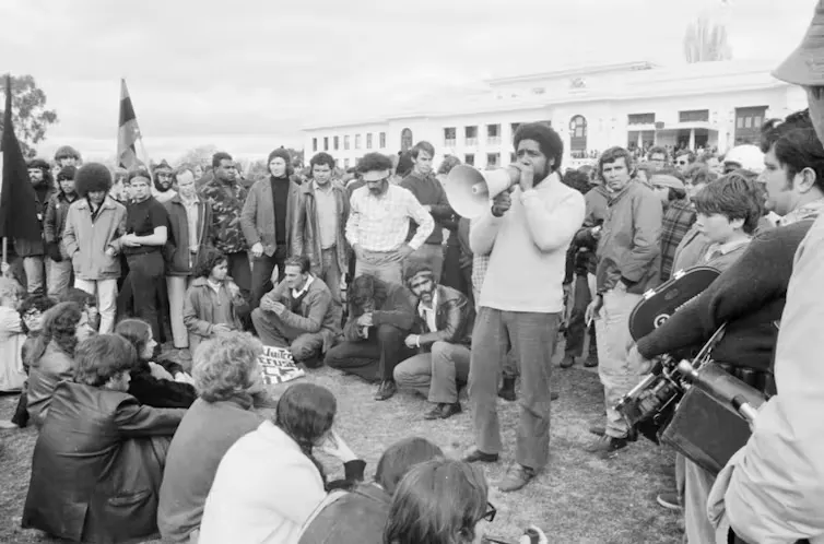 Activist and actor Bob Maza addresses a protest at the Aboriginal Tent Embassy in front of Parliament House