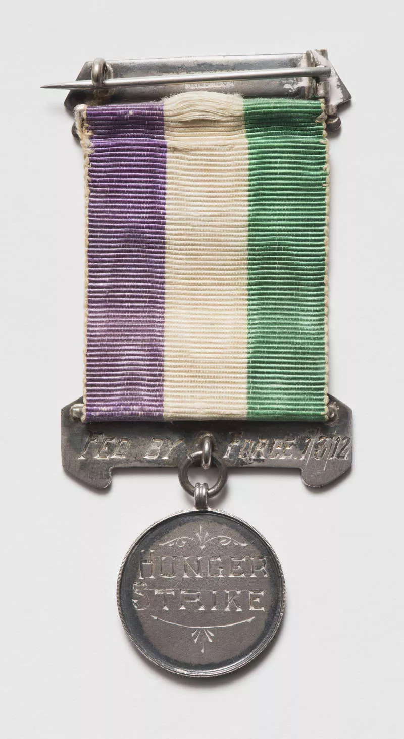 Photograph of a medal with the engraving "Hunger strike."