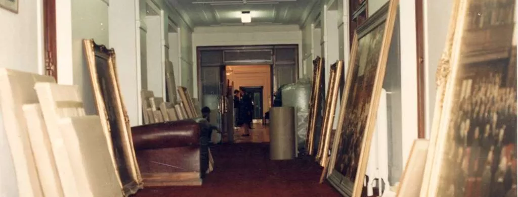 The Senate Government Lobby hallway, with large framed paintings leaning against the wall in preparation for packing and relocation.