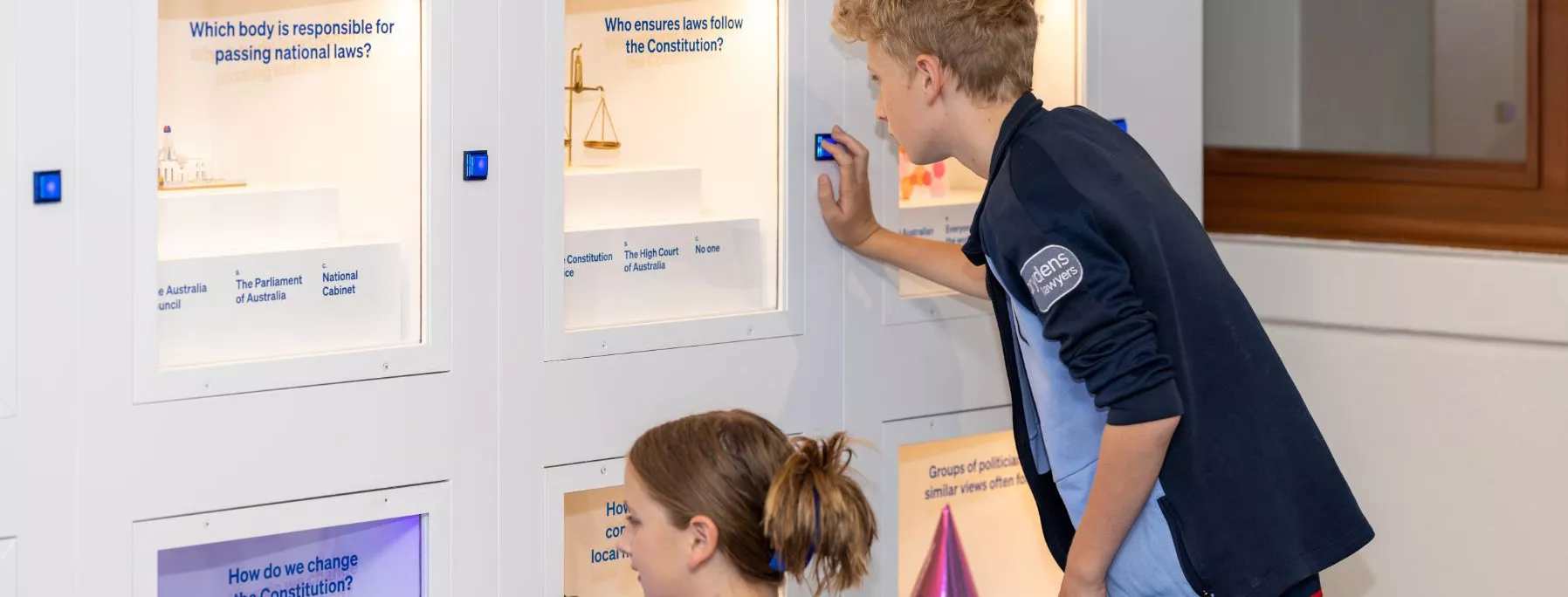 Visitors interacting with the exhibition