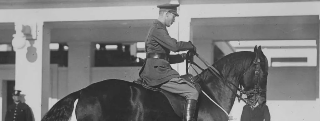 Prince Albert, Duke of York, riding a dark horse with two white 'socks'.