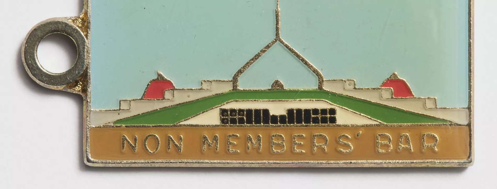 Photograph of a metal tag labled "Non members bar"