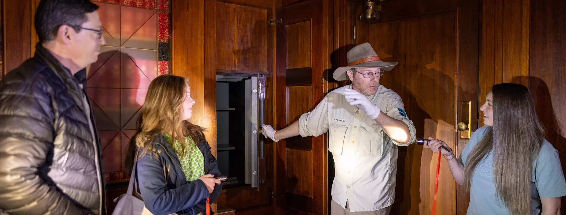 Tim the Yowie Man showing a tour group a room in Old Parliament House.