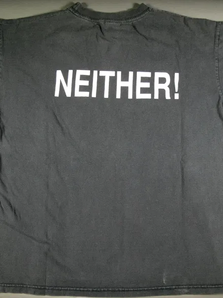 A faded black tshirt with the word 'NEITHER!' printed on the front.