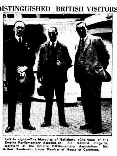 Black and white photograph showing three men identified as The Marquiss of Salisbury, Sir Howard d'Egville and Arthur Henderson, with the heading 'Distinguished British Visitors'.