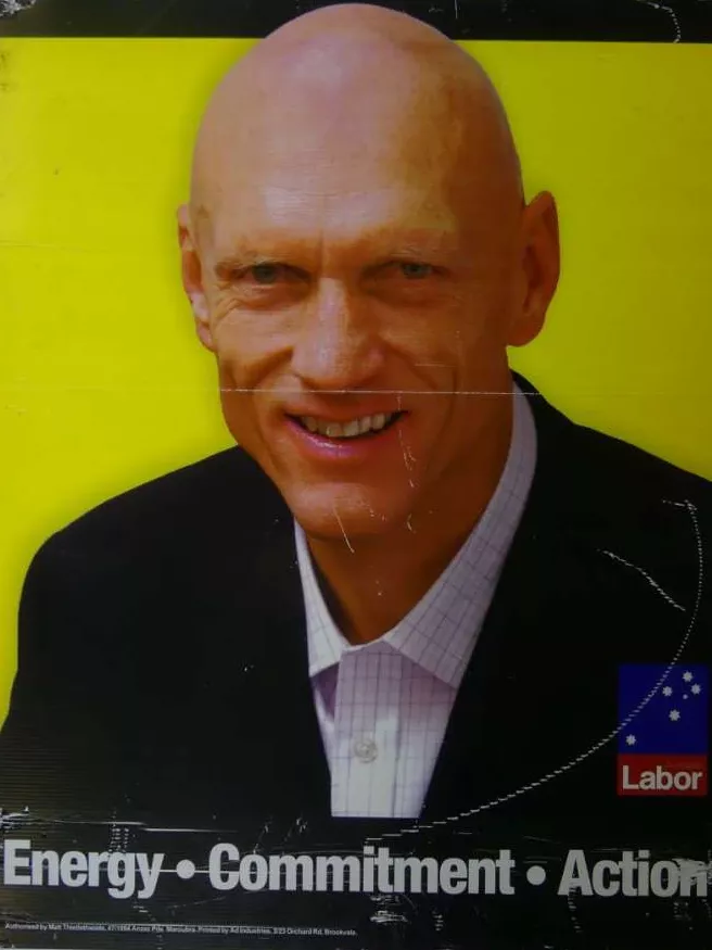 Election corflute sign with Peter Garrett and the words 'Energy, Commitment, Action'.