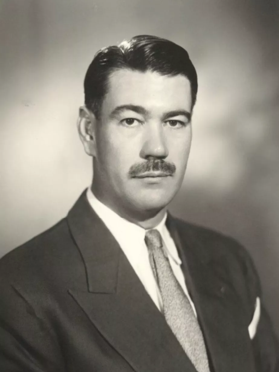 Portrait photograph of Sir Roden Cutler, wearing a suit and tie.