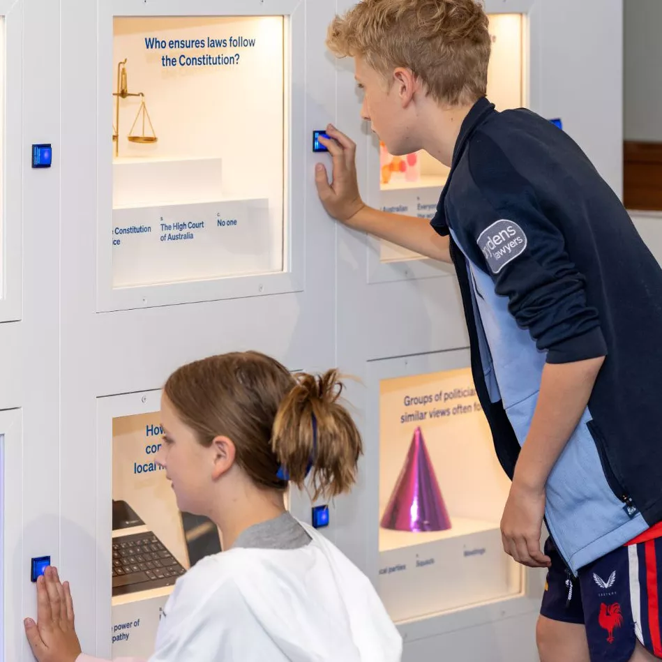 Visitors interacting with the exhibition