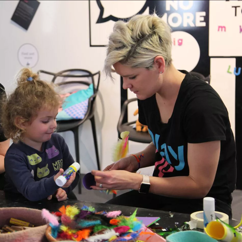 Two children playing with two PlayUP staff members