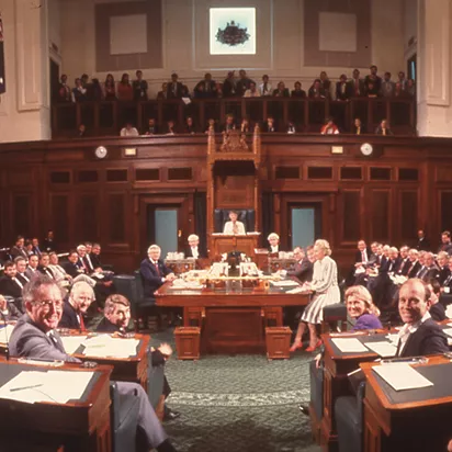 A colour photograph of the House of Representatives Chamber filled with seated politicians