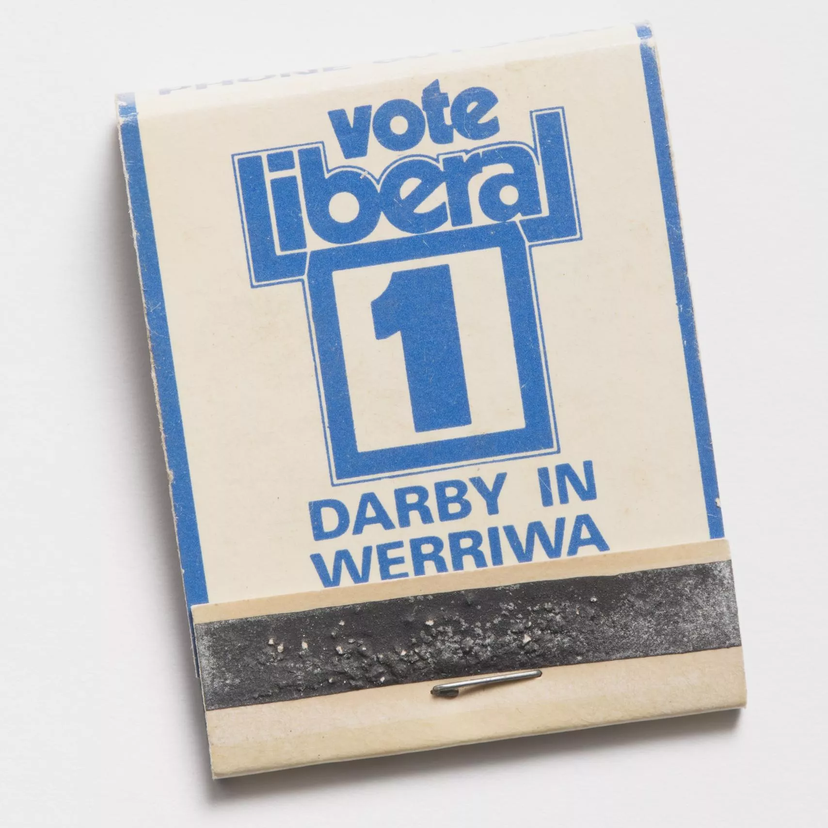 Photograph of a small matchbook reading "Vote liberal 1 Darby in Werriwa"