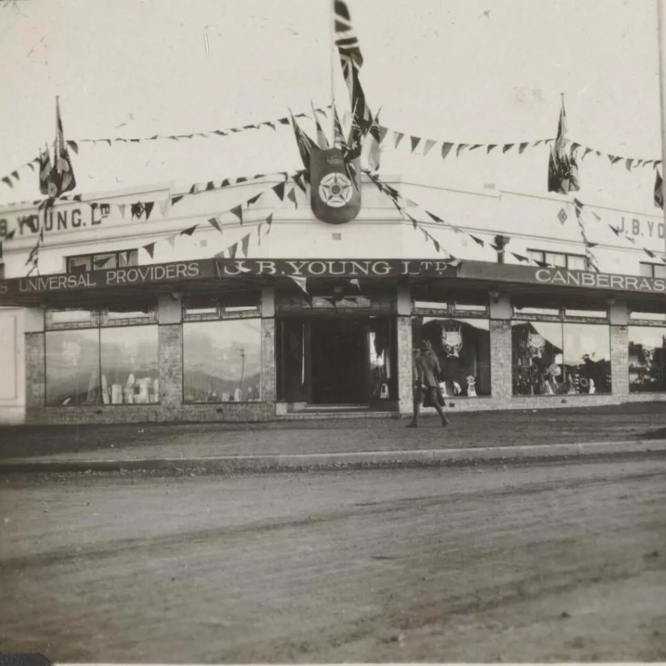 A department store, J B Young Ltd, decorated with flags and bunting.