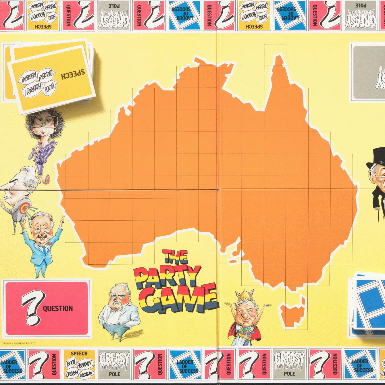 A yellow board game board is open with a map of Australia in the middle and the words The Party Games with red, yellow and blue lettering. Caricatures of politicians feature n the board. Squares along the border have words like Question, Ladder of success, Greasy pole and speech on them. 