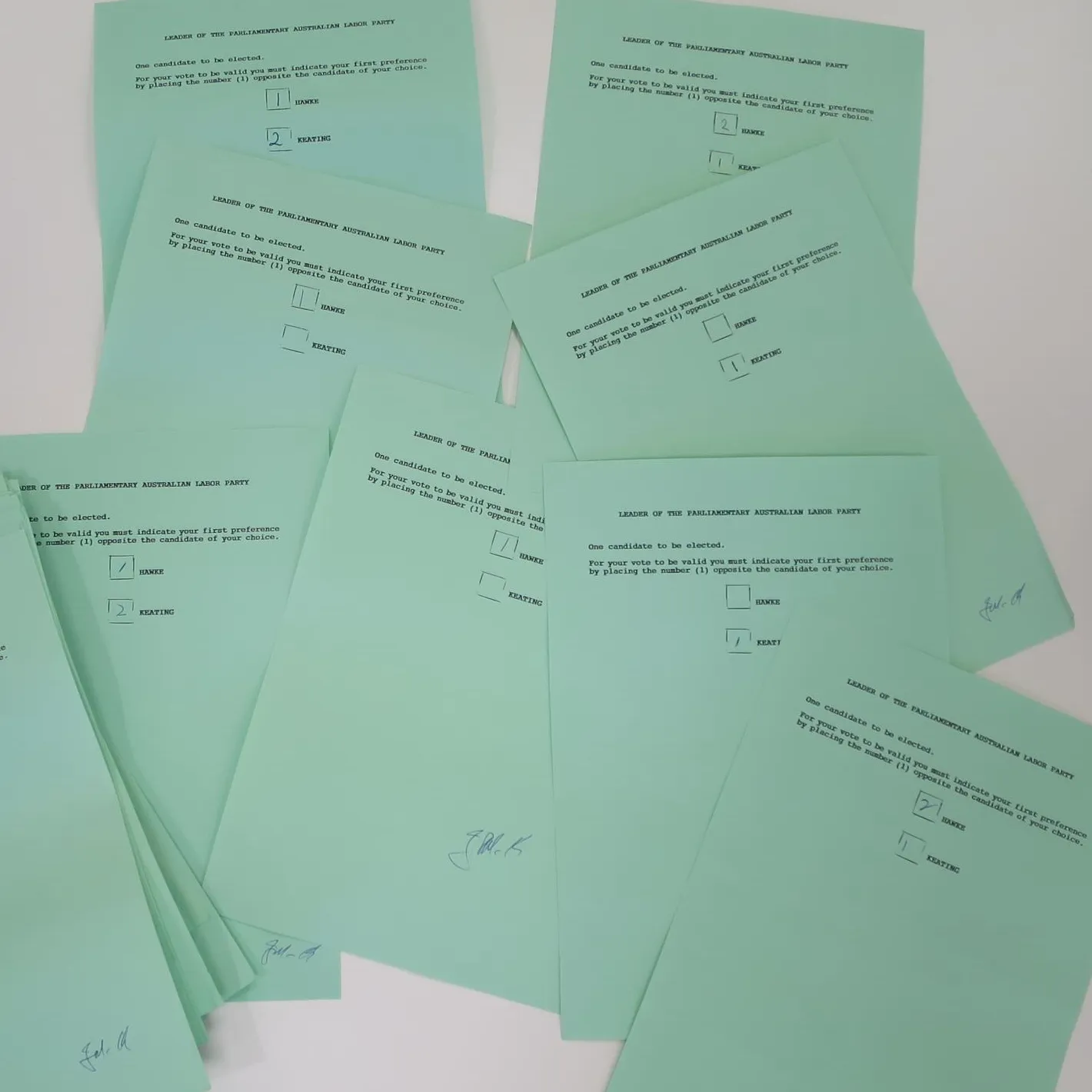 A pile of green ballot papers with two names listed: HAWKE and KEATING.