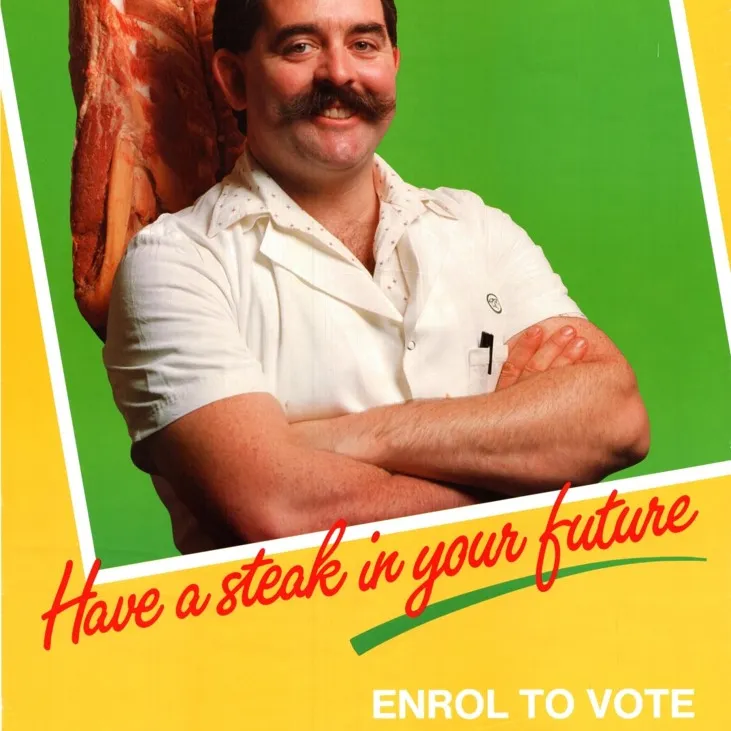 A yellow and green enrol to vote poster with a man in a white shirt standing in front of red meat. Text reads 'Have a steak in your future. Enrol to vote.'