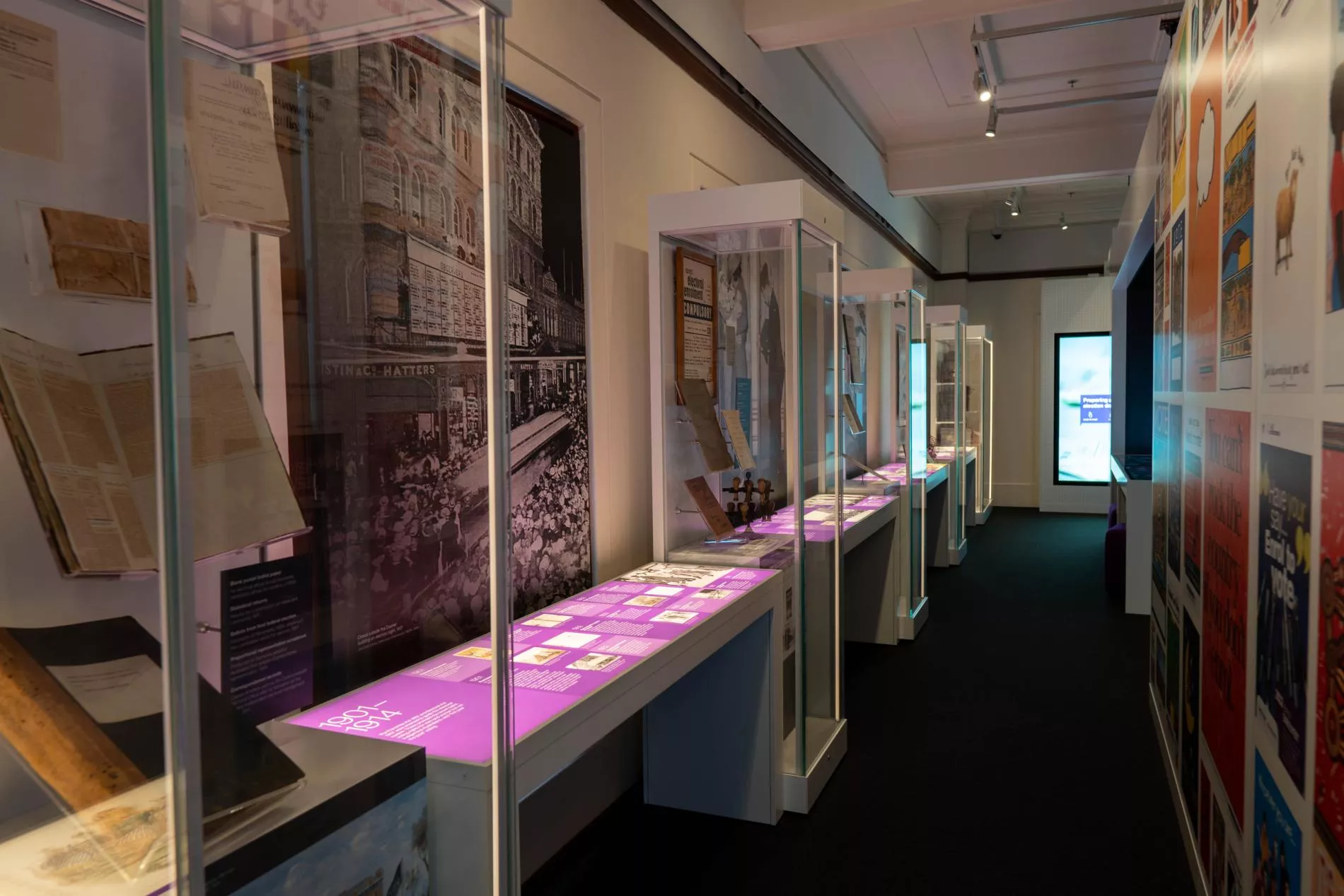 An exhibition space with glass showcases filled with objects An exhibition space with glass showcases filled with objects