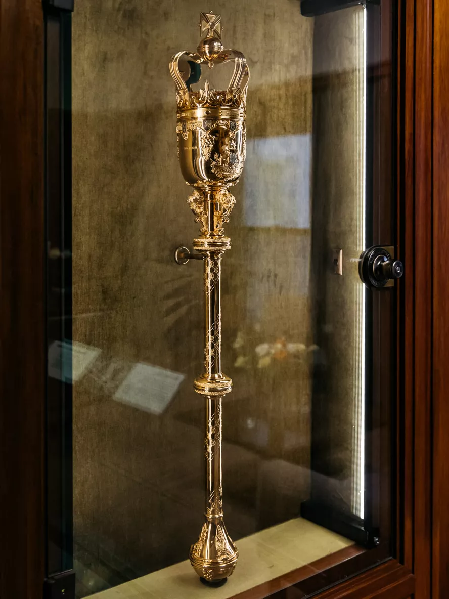 See a replica of the mace that was securely housed in the Speaker's office (the real one is at Australian Parliament House). Parliamentary proceedings can’t start until the Speaker is in the Chamber and the mace is placed in its cradles on the central table. A replica of the mace that was securely housed in Joan’s office