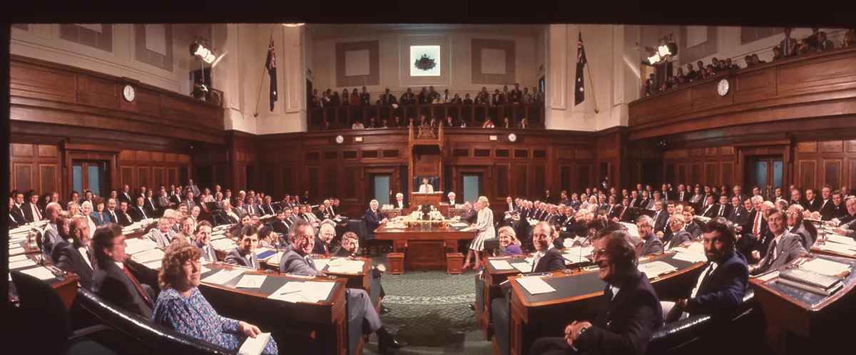 A colour photograph of the House of Representatives Chamber filled with seated politicians A colour photograph of the House of Representatives Chamber filled with seated politicians